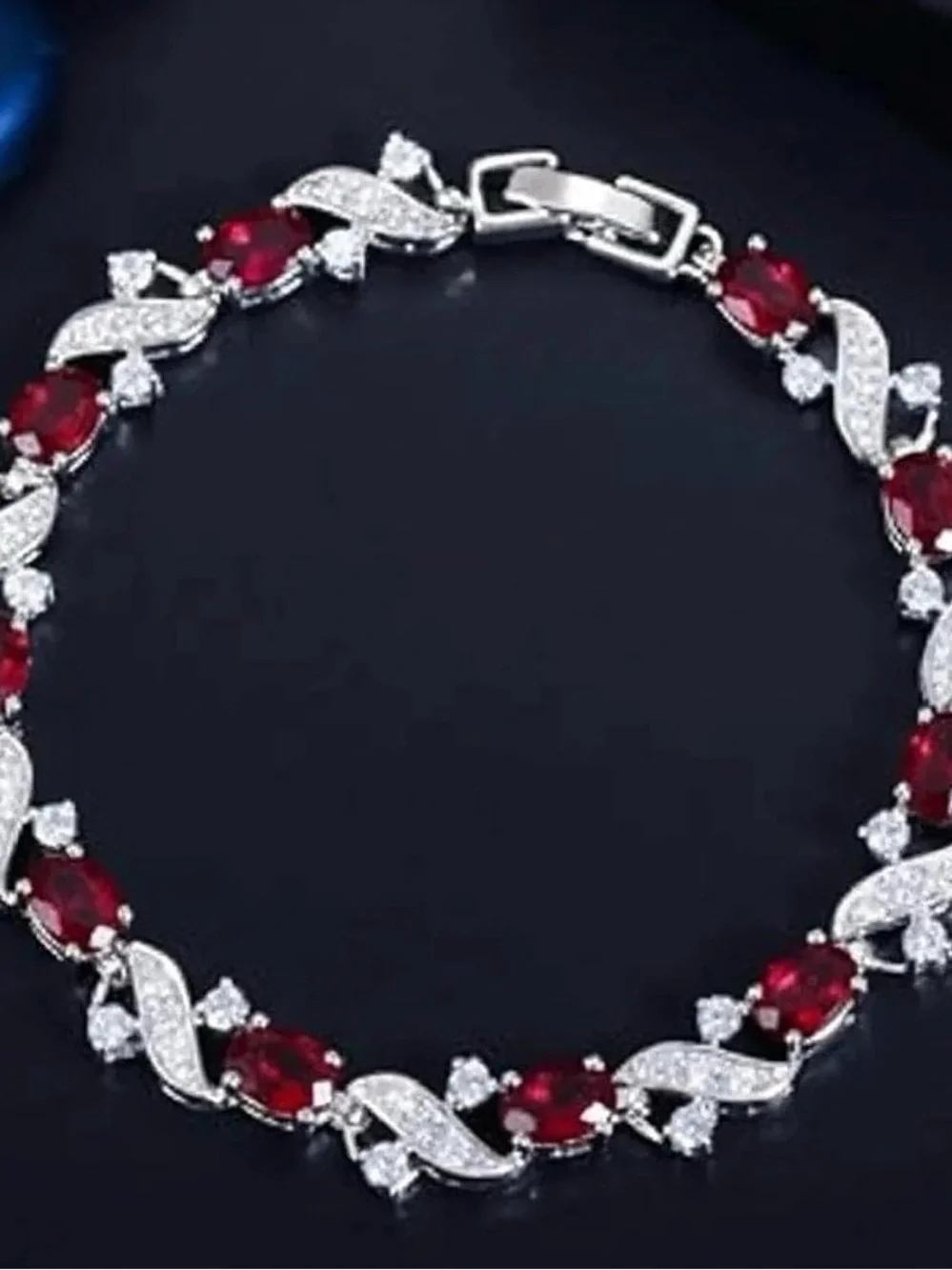 Elegant Silver Bracelet with Deep Red Stones